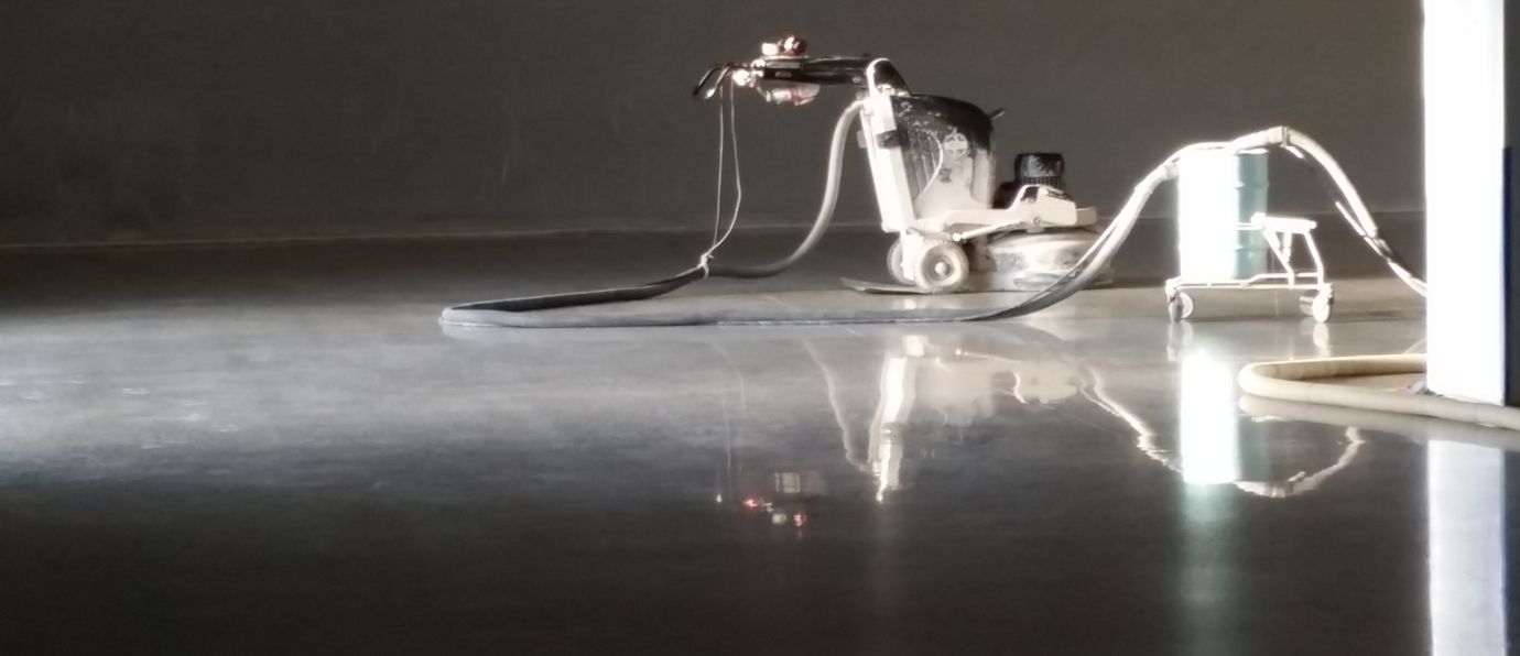 Concrete Grinding Equipment Reflected in Perfectly Polished Concrete