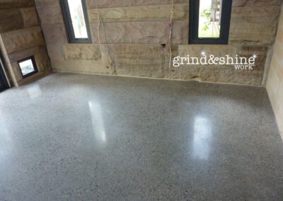 Retrofit floor concrete griding with sandstone walls